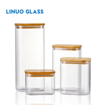 Tarro de vidrio transparente con tapa de bambú